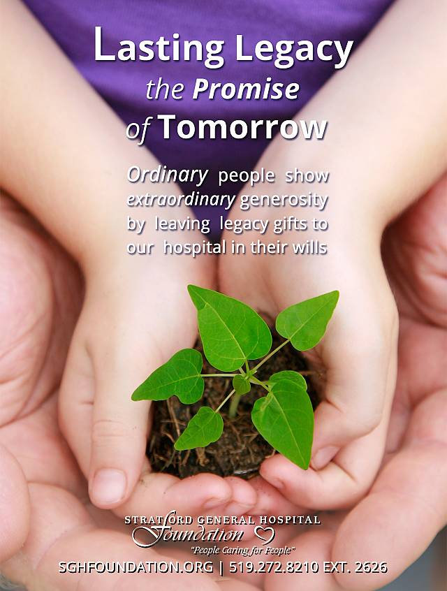 Child holding small plant